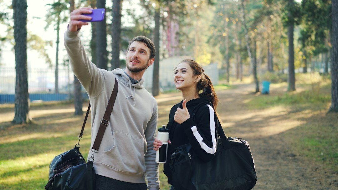 Diverse group of corporate professionals celebrating outdoors near office building